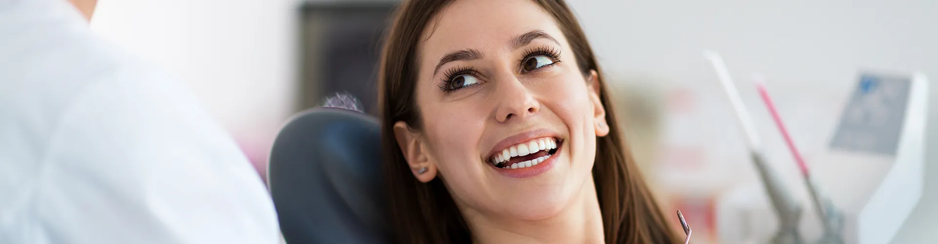 woman smiling up at the dentist
