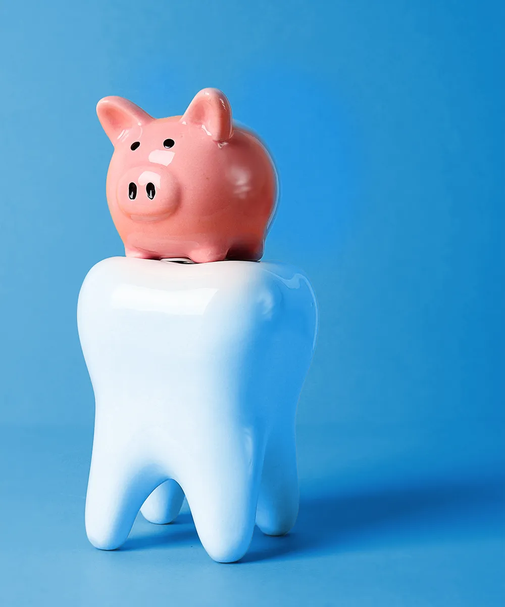 3D rendering of a tooth with a piggy bank on top against a blue background.
