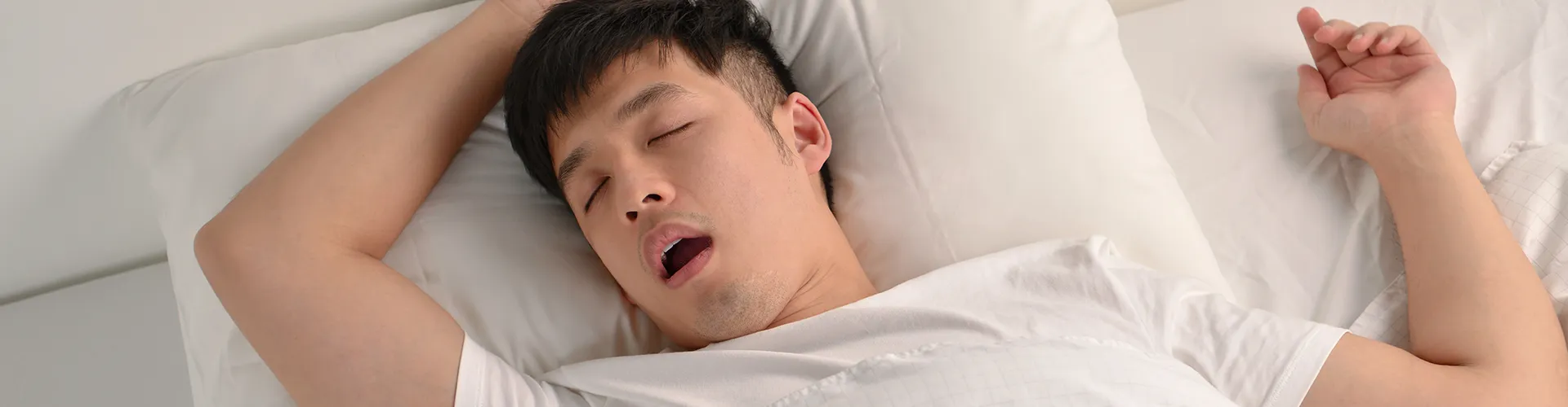 man sleeping on his back