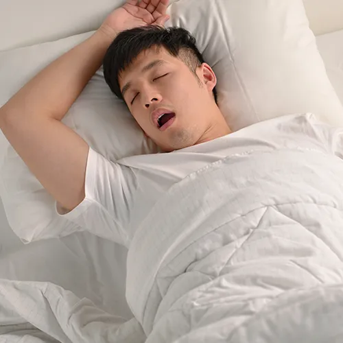 man sleeping on his back